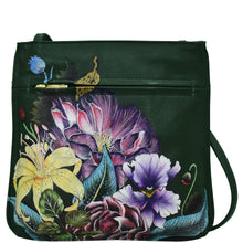 Load image into Gallery viewer, A green Anuschka genuine leather crossbody bag featuring a vibrant floral and butterfly print.
