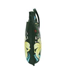 Load image into Gallery viewer, Black umbrella with a floral print featuring yellow and blue flowers, adorned with a Anuschka Slim Crossbody With Front Zip - 452, viewed from the side against a white background.

