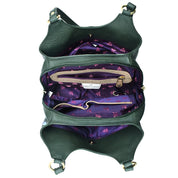 Open dark green genuine leather Anuschka Triple Compartment Satchel - 469 displaying a purple floral-patterned interior with several compartments, including a zippered pocket and multiple sections.