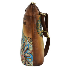Load image into Gallery viewer, Side view of an Anuschka Organizer Crossbody With Extended Side Zipper - 493 in genuine leather with an ornate pattern.
