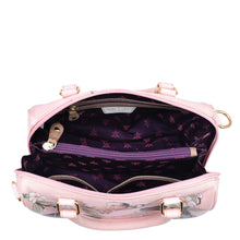 Load image into Gallery viewer, An open pink floral Zip Around Classic Satchel - 625 by Anuschka displaying the inner compartment and multiple pockets.
