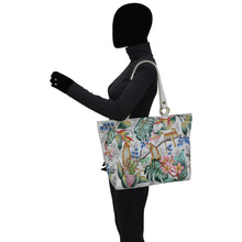 Load image into Gallery viewer, A person modeling a Anuschka Classic Work Tote - 664.
