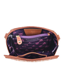 Load image into Gallery viewer, Open Anuschka hand-painted leather bag showcasing RFID protection and interior design, complete with an adjustable strap.
