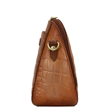 Load image into Gallery viewer, Side view of a brown, crocodile texture leather handbag with RFID protection, a zipper closure, and a gold-tone hardware detail - Anuschka Zip Around Travel Organizer - 668.
