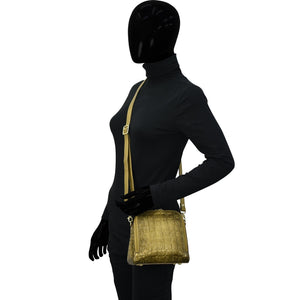 Mannequin dressed in black outfit with a gold zipper displaying a chic, Anuschka Zip Around Travel Organizer - 668.