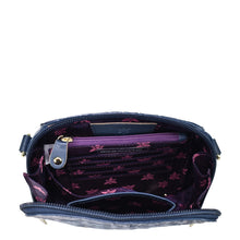 Load image into Gallery viewer, Open Anuschka Zip Around Travel Organizer - 668 with a floral-print interior and RFID protection.
