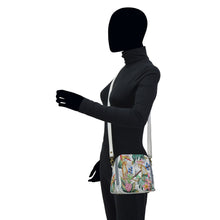 Load image into Gallery viewer, Mannequin wearing a chic black turtleneck, blazer, and an Anuschka Zip Around Travel Organizer - 668 that&#39;s RFID protected, isolated on a white background.
