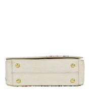 Anuschka's Ivory-colored Flap Crossbody - 683 with floral accents and gold-tone hardware.