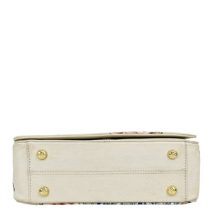Anuschka's Ivory-colored Flap Crossbody - 683 with floral accents and gold-tone hardware.
