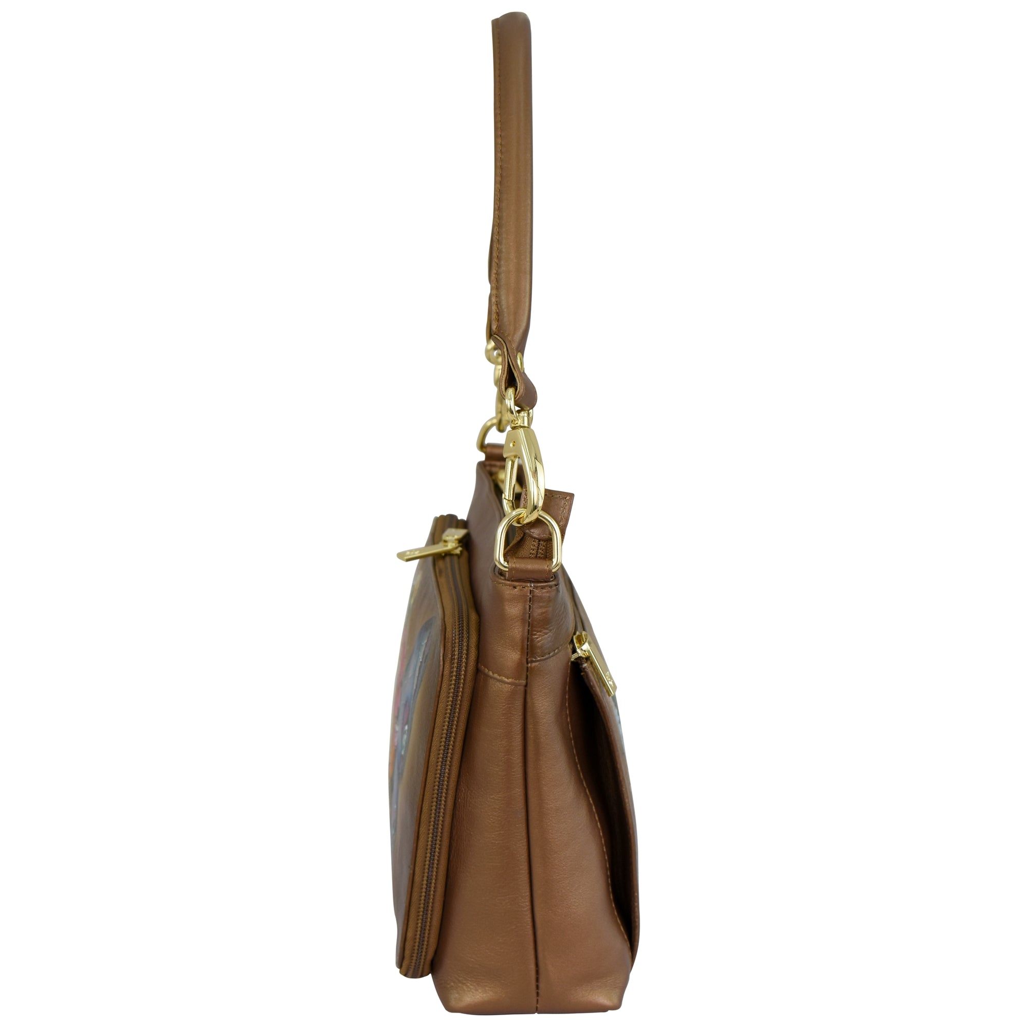 Side view of the Anuschka Shoulder Organizer - 684, a genuine leather handbag featuring a single strap, gold-toned hardware, and a removable crossbody strap.