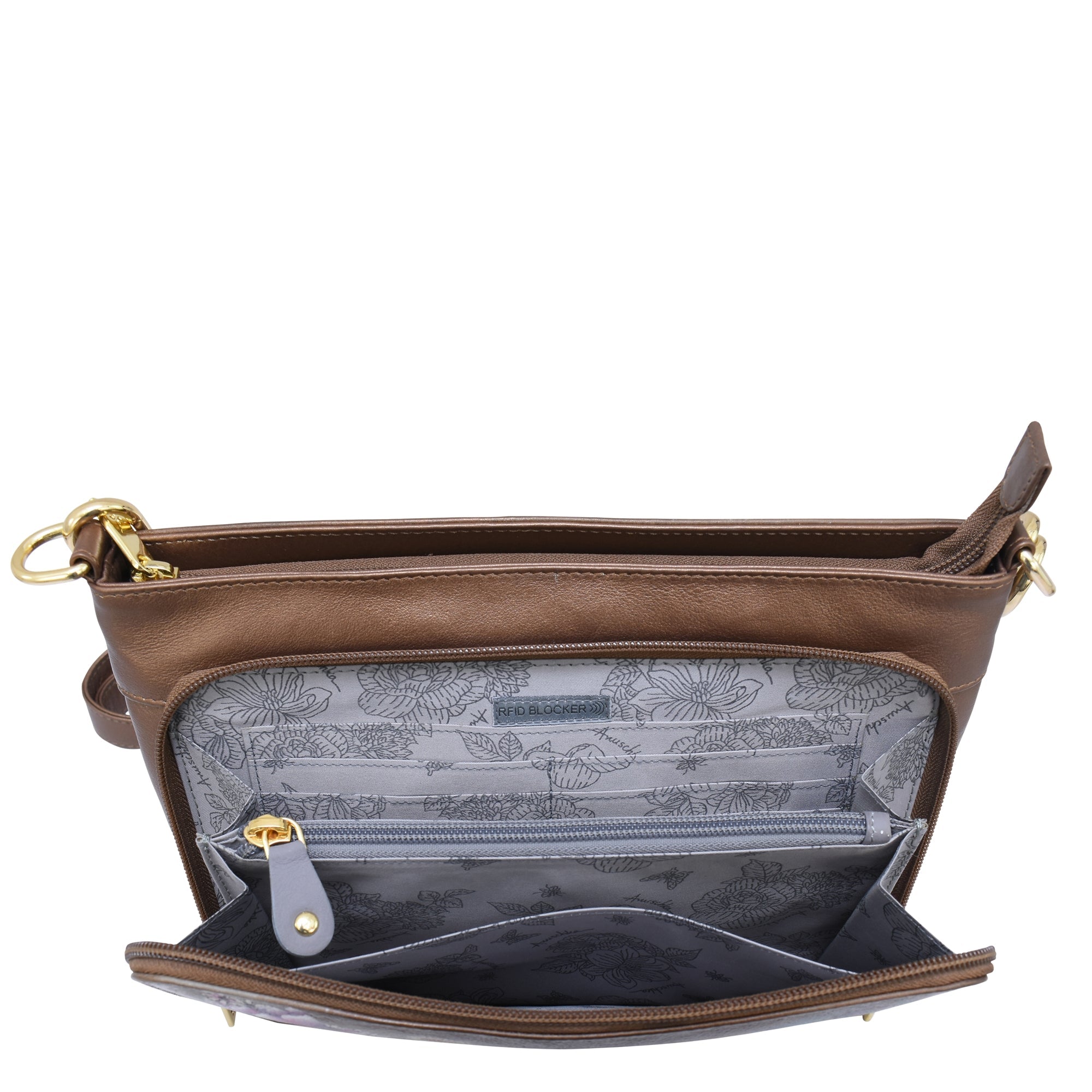 Introducing the Shoulder Organizer - 684 by Anuschka: a genuine leather bag in a rich brown hue, featuring a main zippered compartment and front pocket. The interior boasts a patterned lining with a zippered pouch, card slots, and RFID protection. Gold-tone hardware adds a touch of elegance, while the removable crossbody strap offers versatile styling options.