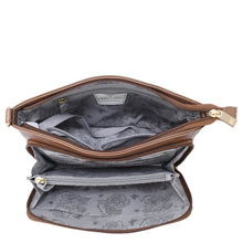 Load image into Gallery viewer, An Anuschka Shoulder Organizer - 684, crafted from brown genuine leather and adorned with gold zippers, opens to showcase a floral-patterned gray interior complete with multiple compartments and a removable crossbody strap for added versatility.
