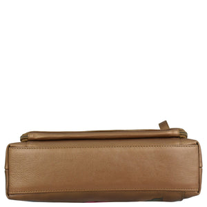 Bottom view of the Shoulder Organizer - 684 by Anuschka, a rectangular tan genuine leather handbag with visible stitching, a zipper at the top, and featuring an optional removable crossbody strap.