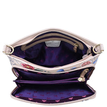 Load image into Gallery viewer, An open, empty Anuschka leather handbag displaying its inner compartments, Large RFID Organizer - 684 features, and floral lining.
