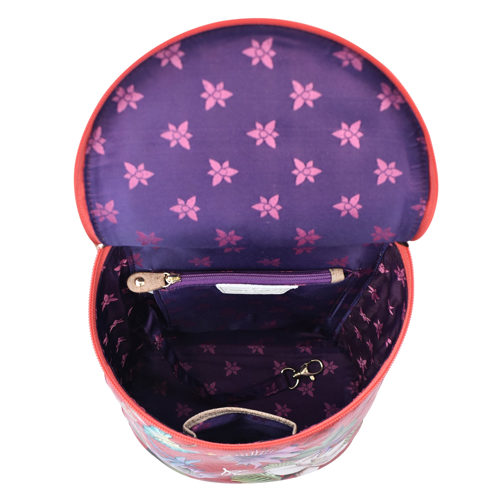 An open, empty Anuschka Bucket Backpack - 685 with a floral pattern interior and adjustable straps.