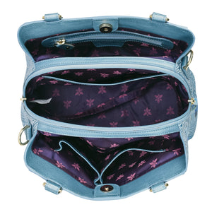 Top-down view of an open, empty Anuschka Multi Compartment Satchel - 690 with purple floral interior lining.