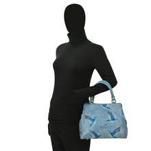 Load image into Gallery viewer, Mannequin displaying a blue leather Multi Compartment Satchel - 690 with a bird pattern by Anuschka.
