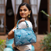 Woman posing with an Anuschka Multi Compartment Satchel - 690.