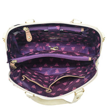 Load image into Gallery viewer, Open Anuschka Wide Organizer Satchel - 695 with genuine leather white exterior and purple interior, featuring a visible zippered pocket.
