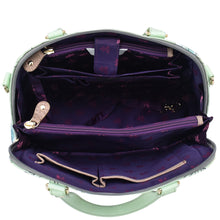 Load image into Gallery viewer, An open, empty Anuschka Wide Organizer Satchel - 695 with a purple interior and multiple compartments.
