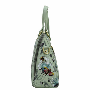 Anuschka Wide Organizer Satchel - 695, floral-patterned light green genuine leather handbag with a single strap and gold-tone hardware.