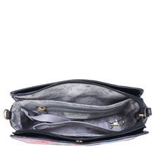 Load image into Gallery viewer, Top view of the Anuschka Triple Compartment Crossbody - 696 in genuine leather, showcasing its triple compartments lined with a floral pattern, a zipper pocket, and an adjustable detachable strap inside.
