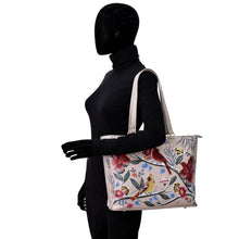 Load image into Gallery viewer, Mannequin in black attire showcasing a Anuschka Large Zip Top Tote - 698 handbag with genuine leather, floral print design.
