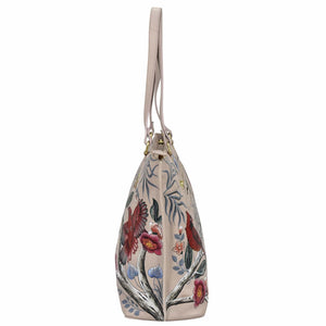 Floral embroidered cream-colored Anuschka Large Zip Top Tote - 698 with a shoulder strap.