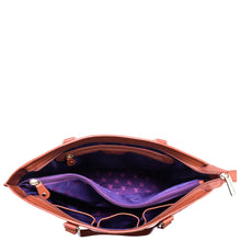 Load image into Gallery viewer, A Large Zip Top Tote - 698 by Anuschka with a purple interior.
