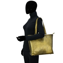 Load image into Gallery viewer, Mannequin dressed in black attire with a hand-painted, Anuschka Large Zip Top Tote - 698.
