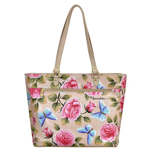 Anuschka's Large Zip Top Tote - 698 featuring a floral print with pink roses and blue butterflies design and a zippered pocket.