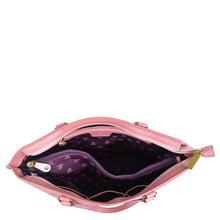 Load image into Gallery viewer, An Anuschka Large Zip Top Tote - 698 with an open pink leather exterior, a purple star-patterned interior, and a shoulder strap.
