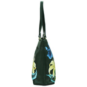 Side view of an Anuschka Large Zip Top Tote - 698 in dark green genuine leather with long handles, decorated with hand-painted artwork featuring yellow and blue flowers.