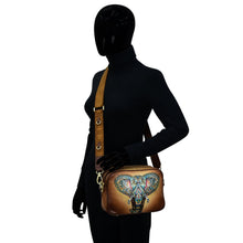 Load image into Gallery viewer, Mannequin displaying a Anuschka Twin Top Messenger - 704 with an elephant design and RFID protection.
