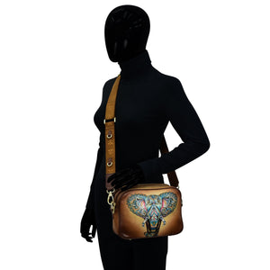 Mannequin displaying a Anuschka Twin Top Messenger - 704 with an elephant design and RFID protection.