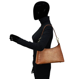 Mannequin with a black bodysuit and an Anuschka tan leather Hobo With Chain Strap - 707.