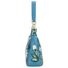Load image into Gallery viewer, Blue floral-patterned genuine leather Anuschka wristlet bag with gold-tone hardware.
