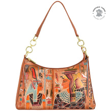 Load image into Gallery viewer, The Anuschka Zip-Top Shoulder Hobo - 707 is a sophisticated leather hobo bag featuring an Egyptian theme with illustrations of two figures and hieroglyphics, gold ring accents, a chain detail shoulder strap, and a roomy interior.
