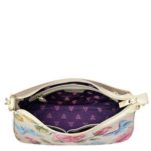 Genuine leather floral-patterned handbag with open zip showing purple interior and a shoulder strap, the Anuschka Hobo With Chain Strap - 707.