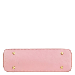 Pink Anuschka genuine leather clutch with gold-tone studs on a white background.