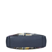 Load image into Gallery viewer, Side view of an Anuschka Satchel With Crossbody Strap - 708 with a dark blue leather edge.
