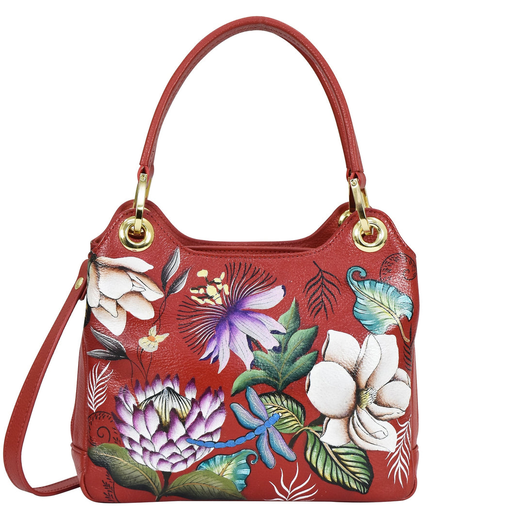Red leather Anuschka satchel with floral pattern embroidery.