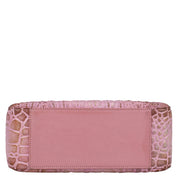 Pink Anuschka clutch with crocodile skin texture, plain central panel, and chain link detail.