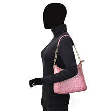 Load image into Gallery viewer, A mannequin dressed in black with a pink, genuine leather Zip-Top Shoulder Hobo - 709 from Anuschka showcasing chain link detail.
