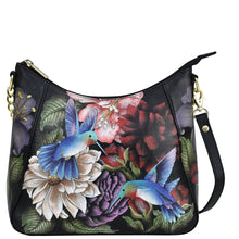Load image into Gallery viewer, Replace the product in the sentence below with the given product name and brand name:
Sentence: Black leather handbag with floral and bird print design, featuring a zippered pocket.
Product Name: Zip-Top Shoulder Hobo - 709
Brand Name: Anuschka

Revised Sentence: Anuschka Zip-Top Shoulder Hobo - 709 black leather handbag with floral and bird print design, featuring a zippered pocket.
