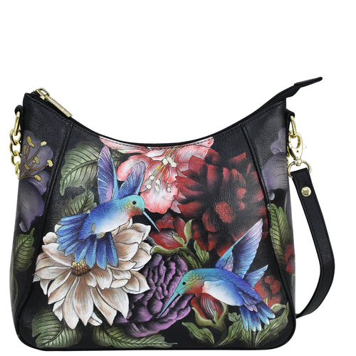 Replace the product in the sentence below with the given product name and brand name:
Sentence: Black leather handbag with floral and bird print design, featuring a zippered pocket.
Product Name: Zip-Top Shoulder Hobo - 709
Brand Name: Anuschka

Revised Sentence: Anuschka Zip-Top Shoulder Hobo - 709 black leather handbag with floral and bird print design, featuring a zippered pocket.