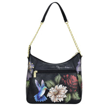 Load image into Gallery viewer, A Zip-Top Shoulder Hobo - 709 with a floral and bird print design and a chain link detail strap by Anuschka.
