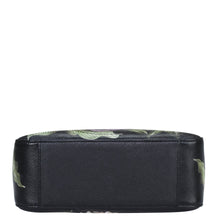 Load image into Gallery viewer, Black rectangular Anuschka cosmetics bag with a green leaf pattern on the upper section and a chain link detail.
