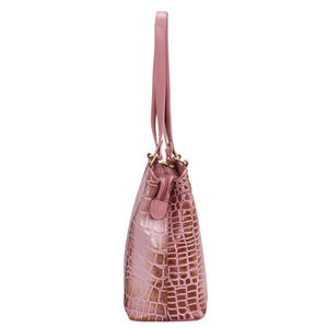 A pink crocodile pattern leather Medium Everyday Tote - 710 with a zip entry and a strap by Anuschka isolated on a white background.