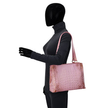 Load image into Gallery viewer, Mannequin displaying a pink crocodile pattern leather exterior Medium Everyday Tote - 710 with zip entry by Anuschka.

